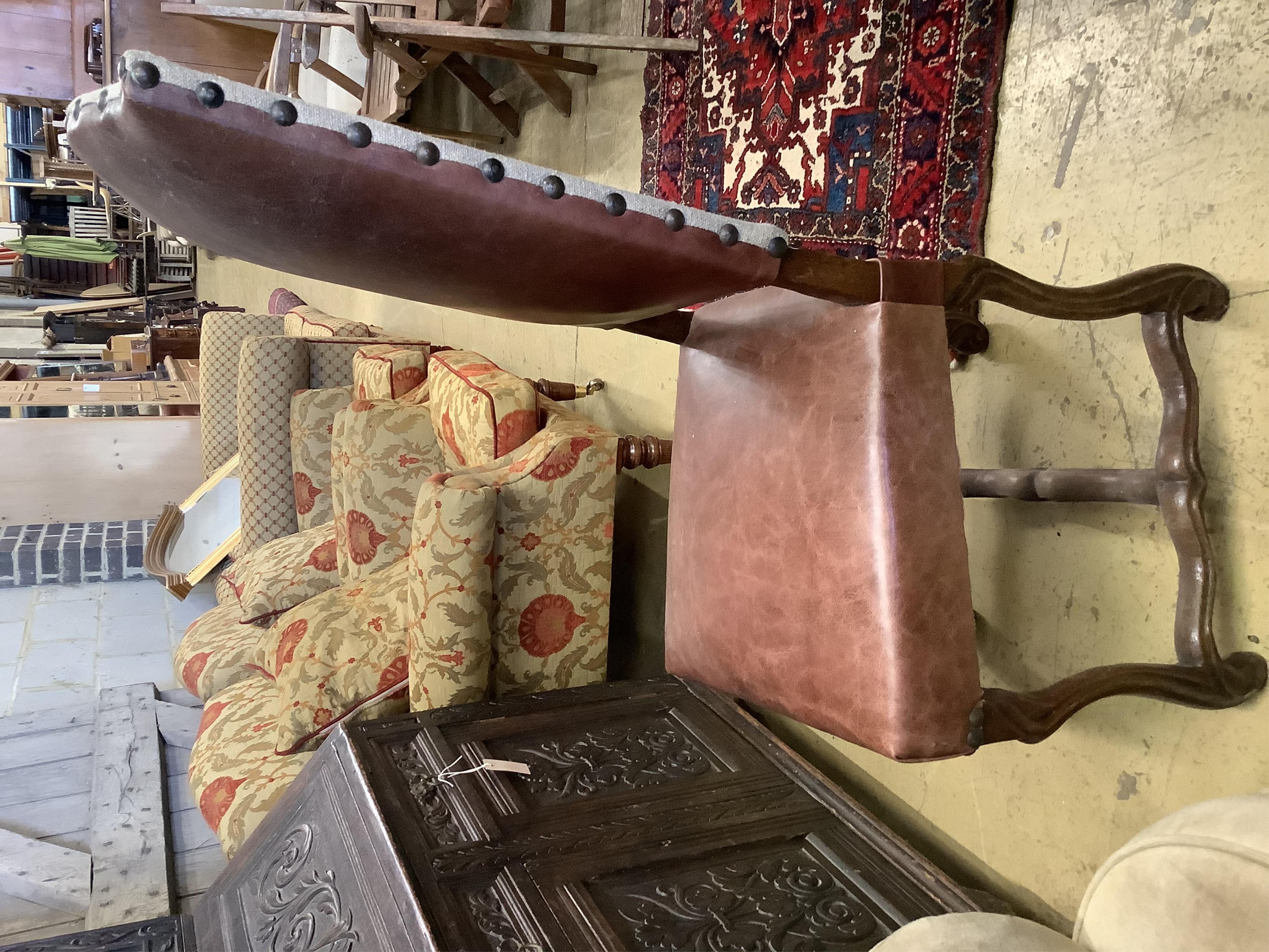 A set of six French leather high back dining chairs